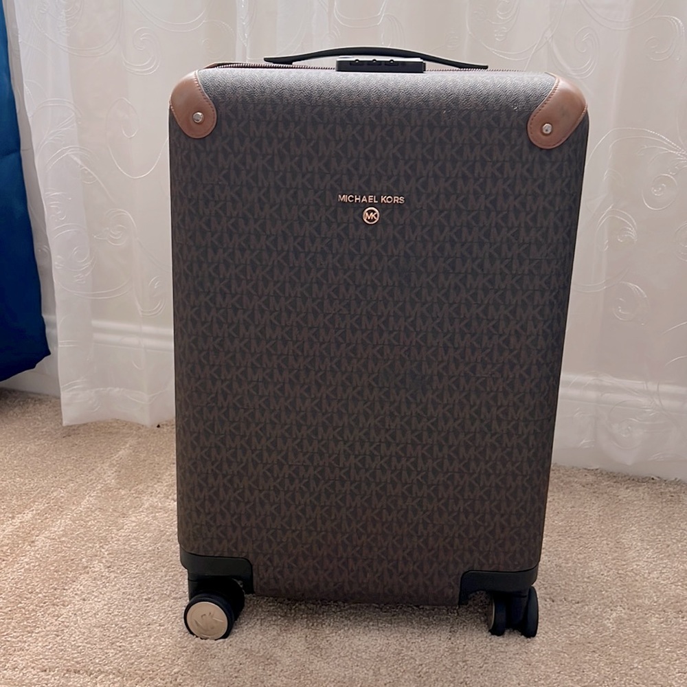 Brown Micheal Kors carry on luggage